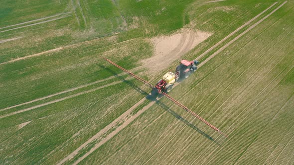 Aerial View of Tractor That Irrigates Field