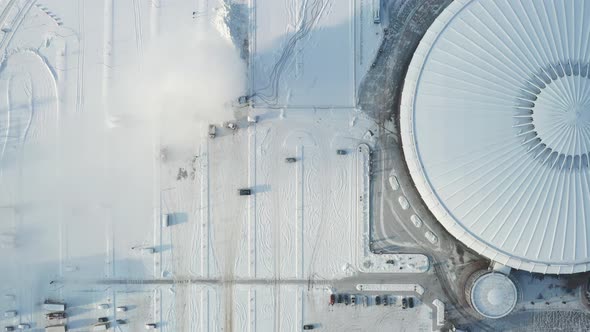 Top view in winter of a modern sports complex with parking in Minsk. Belarus