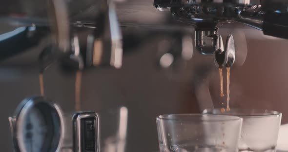 Female Tender Hand Putting Glass with Chocolate and Condensed Milk in a Milk Frother of a Coffee