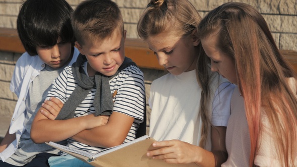 Serious children in preschool reading books