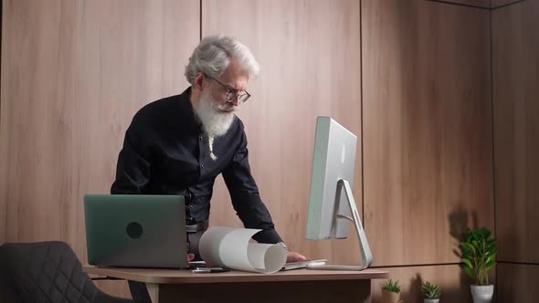 Elegant Grayhaired Scientist Checks Results of Research Thoughtful University Lecturer Checks