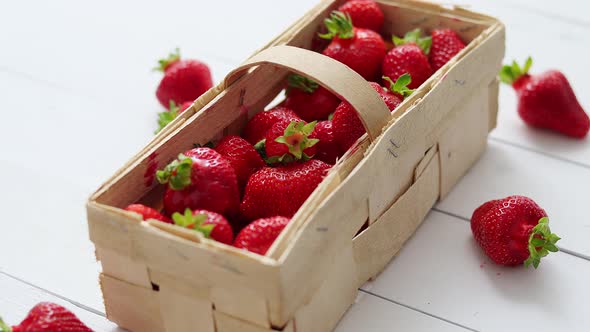 Wooden Container with Fresh Red Strawberries, Placed on White Table