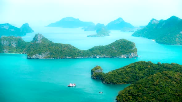 Water Flows Between Islands with Big Green Trees in Thailand Timelapse