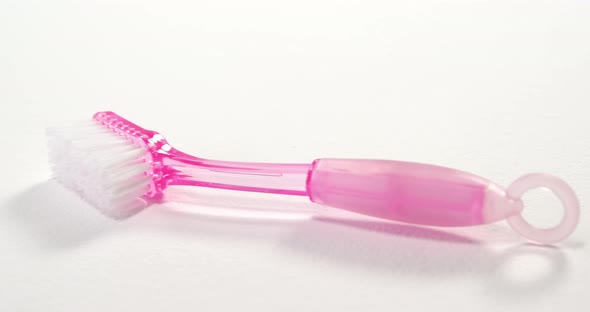 Close-up of pink cleaning brush