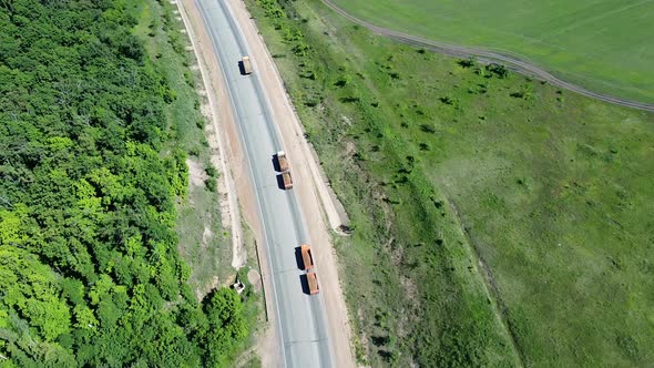 Aerial View of the Car Traffic. Flight By Drone Above the Trucks with Cargo