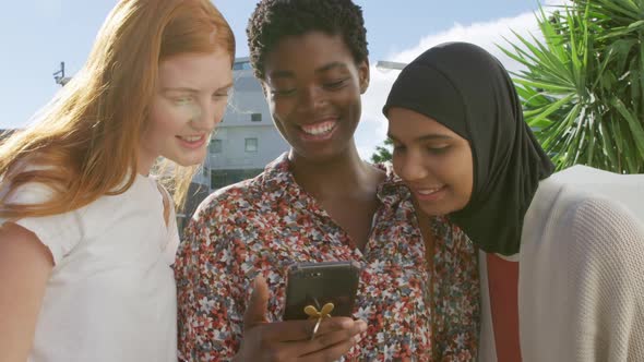 Young adult female friends hanging out together