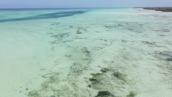 Aerial View of a Boat in the Ocean Near the Coast of Zanzibar Tanzania