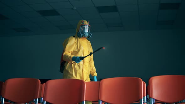 Disinfector Is Chemically Sanitizing an Audience Hall