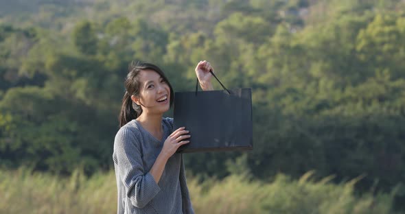 Woman holding paper bag