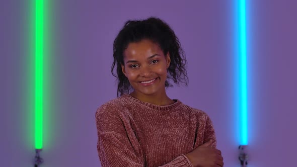 Portrait of Afro American Young Woman Coquettishly Posing for the Camera