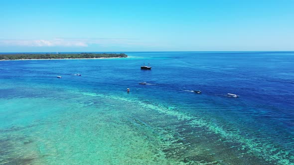 Tropical above copy space shot of a sunshine white sandy paradise beach and aqua blue water backgrou