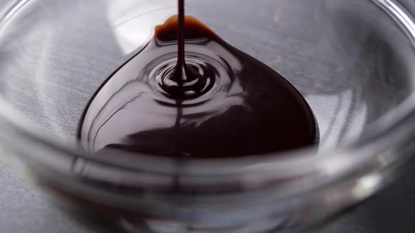 Chocolate Sauce Pouring Into Bowl