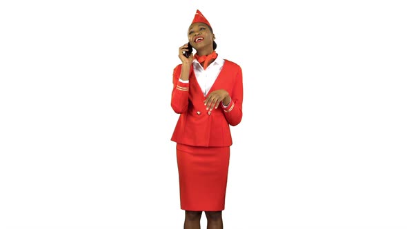 Stewardess Afro American Speaks on the Phone and Steps Away . Alpha Channel