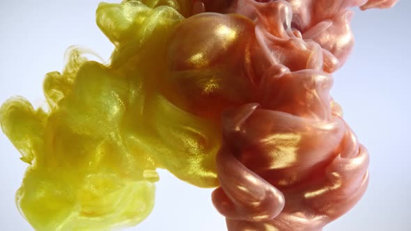 Colorful Nacreous Paint in Water Against White Background. alt