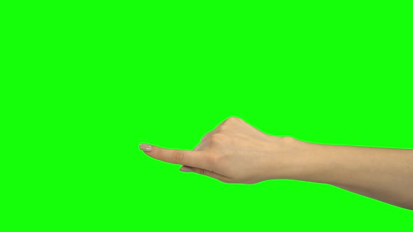 Hand of Girl Pointing at Something. Green Screen. Close Up