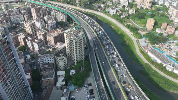 Aerial footage of Morning rush hour of traffic to enter the town in shenzhen city, China. Hypelapse