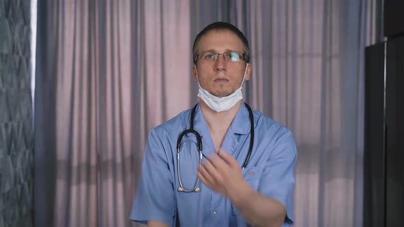 Portrait of Young Doctor Wearing Protective Mask