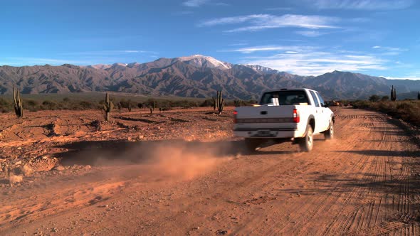 Pickup Truck on Desert Road near the Andes Mountains. 4K Version.