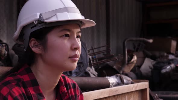 Depressed Asian Female worker or engineer portrait.