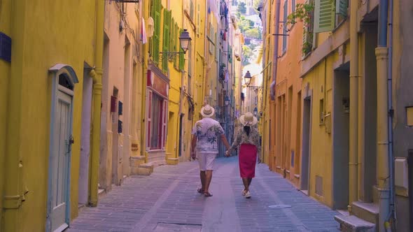 Menton Francecouple Men and Woman on Vacation at the Cote d Azur France View on Old Part of Menton