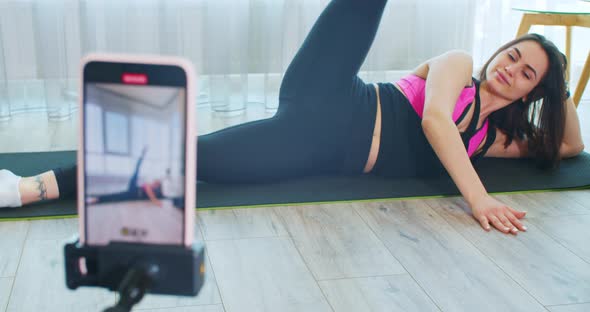 Online Yoga Courses Run By a Young Woman Recording on Her Phone Quarantine