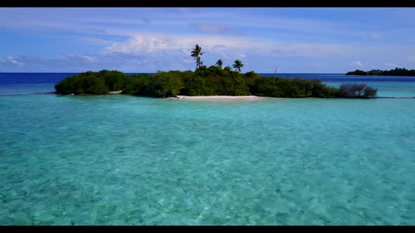 Aerial seascape of idyllic lagoon beach holiday by blue lagoon and white sand background of a picnic