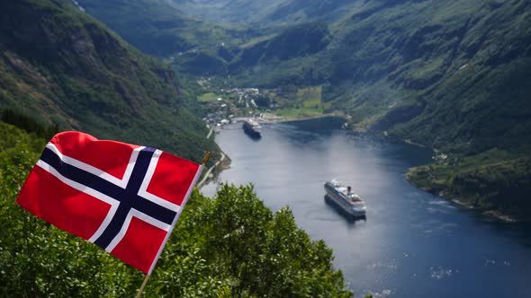 Norwegian Flag And Cruise Ship On Fjord