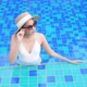 Young asian woman enjoy around outdoor swimming pool for leisure - VideoHive Item for Sale