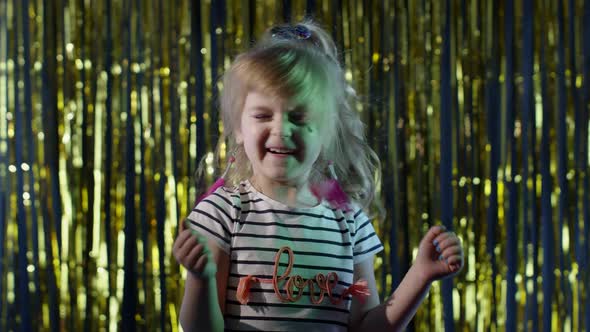 Portrait of Trendy Stylish Teen Girl Listening To Music Dancing Shaking Head at Disco Party Club