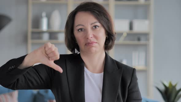 Portrait of Old Businesswoman Gesturing Thumbs Down