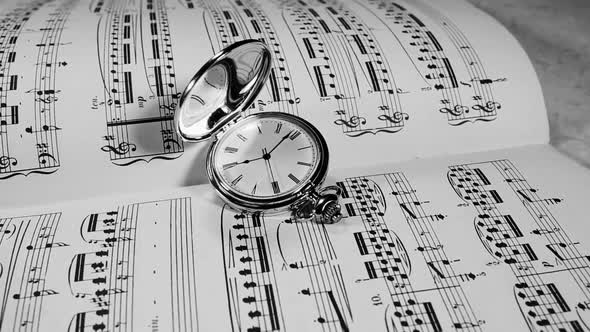 Watch on the Background of Musical Notes