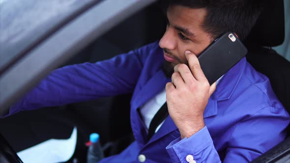 Muslim Man Driving the Car and Standing in Traffic Jam