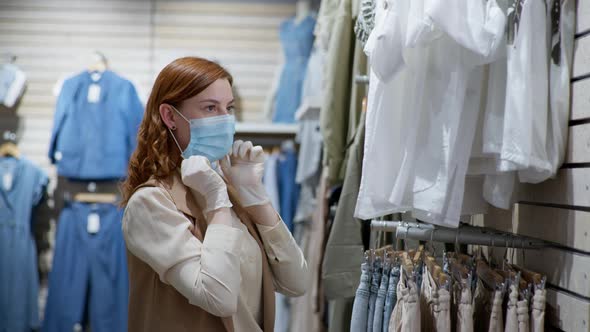 Safe Shopping, Portrait of Beautiful Female Shopper with Medical Gloves Putting on Face Mask To