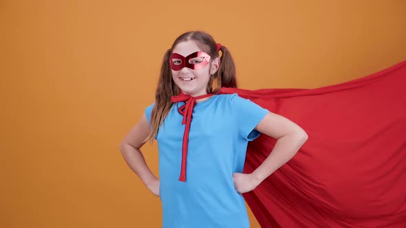 Very Positive Girl Disguised in a Movie Superhero Smiling at the Camera