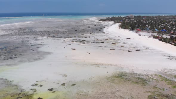 Long Ocean Low Tide with Bared Bottom in Shallow Water Zanzibar Aerial View