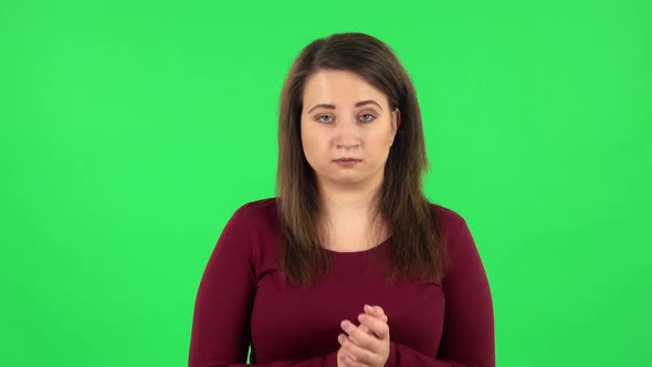 Portrait of Pretty Girl Clapping Her Hands with Dissatisfaction, Green Screen