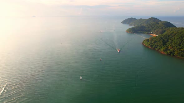 Fishing boat sailing in the sea near river mouth