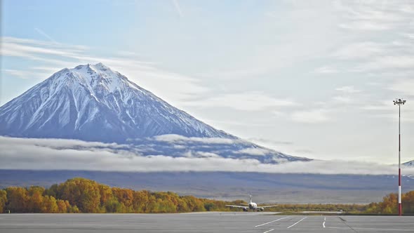 Beautiful View of Plane Taking Off on Background of Mountains and Forests in Kamchatka