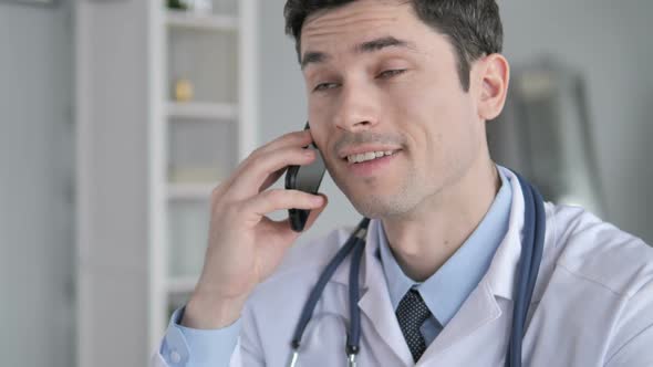 Doctor Talking on Phone with Patient