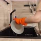 A cleaner washes dishes under running water in the sink in a modern kitchen. The concept of cleaning - VideoHive Item for Sale