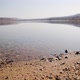 Public beach of Dead Sea shore near Ein Bokek, Israel. Sandy beach with clear water in sunny day - VideoHive Item for Sale