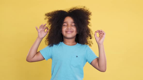 Smiling Little African American Girl Meditating or Dreaming. Joy and Happiness on Face, Inhale