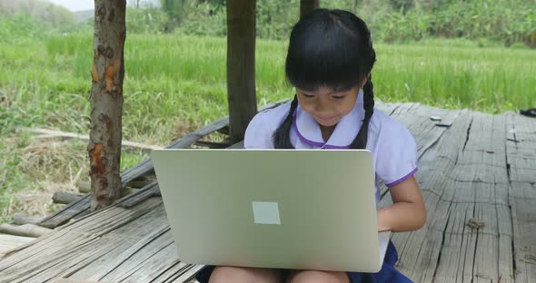 Little Girl Using Laptop alt