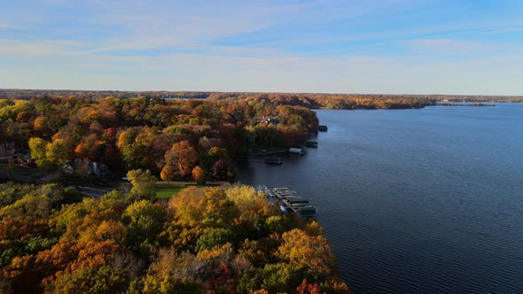aerial view of homes and trees by the Lake front in Minnetonka, Minnesota during autumn color’s peak