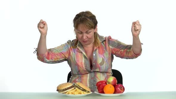 Joyful Woman Choosing Between Healthy and Unhealthy Food