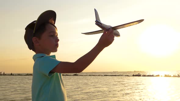 The Kid Plays with the Plane Depicting Flight