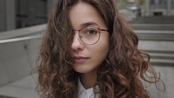 Face Of Young Girl With Long Curly Hair