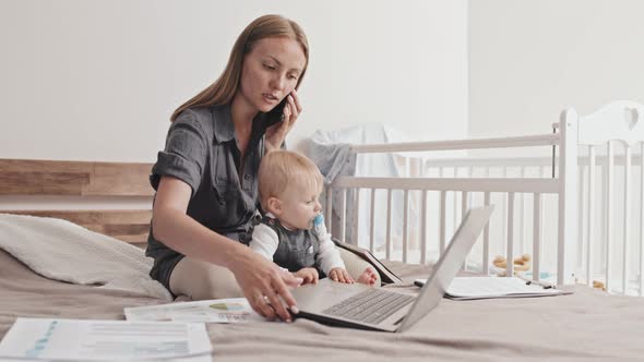 Young Mother Working at Home