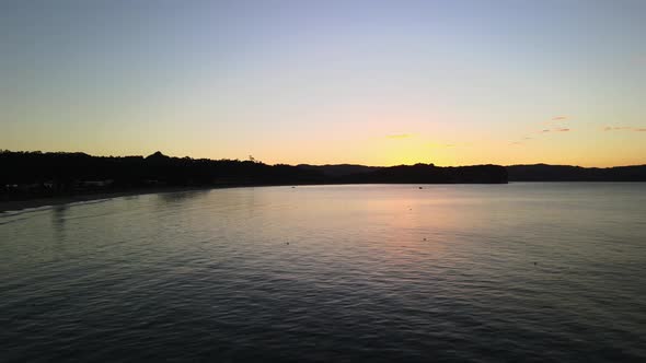 Sunset over the Cooks bay in New Zealand