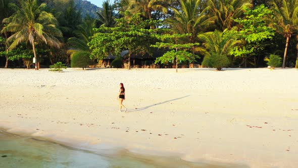 Young Smiling Ladies on Vacation in The Sun at The Beach on Sunny Blue and White Sand